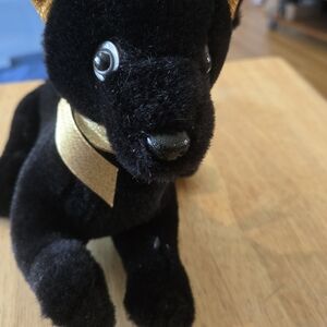 Elegant Black Plush Dog with Gold Ears